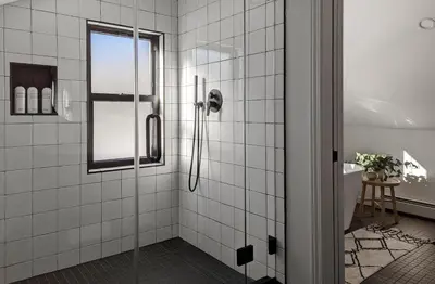 a bathroom with a shower with a glass door at Acorn Lodge - Luxury Cabin, Catskills, Windham Mountain, Hunter Mountain in Cairo
