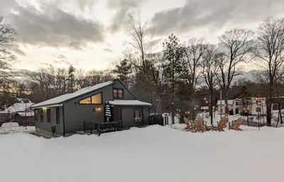 a small house in the snow in the snow at Acorn Lodge - Luxury Cabin, Catskills, Windham Mountain, Hunter Mountain in Cairo
