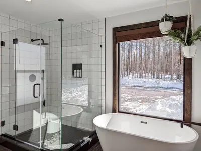 a bathroom with a tub and a large window at Acorn Bungalow - Luxury Cabin, Catskills, Windham Mountain, Hunter Mountain in Cairo