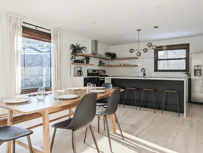 a kitchen and dining room with a wooden table and chairs at Acorn Bungalow - Luxury Cabin, Catskills, Windham Mountain, Hunter Mountain in Cairo