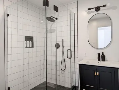 a bathroom with a shower with a sink and a mirror at Acorn Bungalow - Luxury Cabin, Catskills, Windham Mountain, Hunter Mountain in Cairo