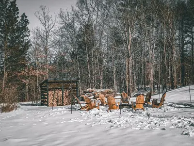 a table and chairs sitting in the snow at Acorn Bungalow - Luxury Cabin, Catskills, Windham Mountain, Hunter Mountain in Cairo
