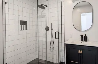 a bathroom with a shower with a sink and a mirror at Acorn Bungalow - Luxury Cabin, Catskills, Windham Mountain, Hunter Mountain in Cairo