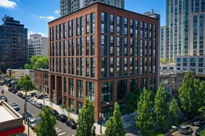 an overhead view of a brick building in a city at Court Square Hotel Long Island City New York , Belvilla District 6 Formerly Sonder in Long Island City