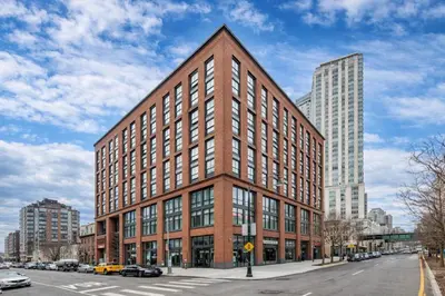 a large red brick building on a city street at Court Square Hotel Long Island City New York , Belvilla District 6 Formerly Sonder in Long Island City