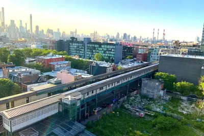 an aerial view of a city with a train station at Court Square Hotel Long Island City New York , Belvilla District 6 Formerly Sonder in Long Island City