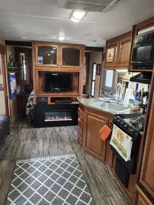 an rv kitchen with a sink and a stove at Rv adventure Roscoe Pet friendly in Roscoe