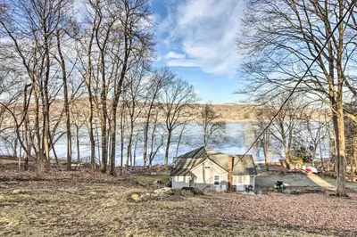 an old house in the middle of a lake at Charming Danbury Cottage with Lake Kenosia Access! in Danbury