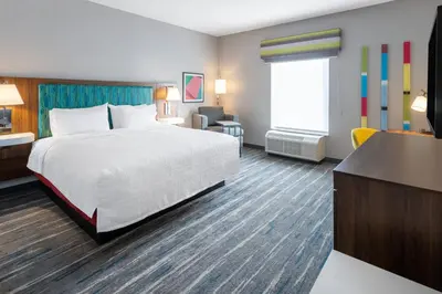 a hotel room with a bed and a desk at Hampton Inn Monticello, Ny in Monticello