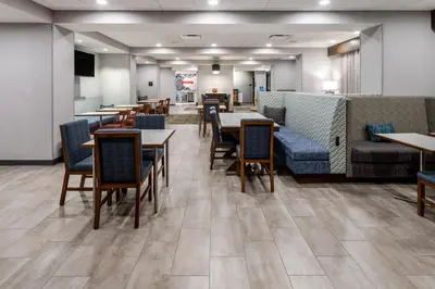 a dining room with tables and chairs and tablesktop at Hampton Inn Monticello, Ny in Monticello