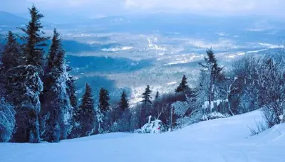 a snow covered hill with trees on top of it at SPECTACULAR CATSKILLS 4 BEDROOM VACATION OASIS- Gorgeous Hunter Mountain Views! in Hunter