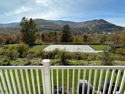 a white fence with mountains in the background at SPECTACULAR CATSKILLS 4 BEDROOM VACATION OASIS- Gorgeous Hunter Mountain Views! in Hunter