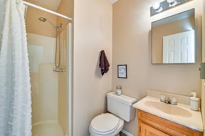 a bathroom with a toilet and a sink and a shower at Near Hiking and Skiing Hunter Mountain Getaway! in Elka Park