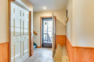 a hallway with a door and a stairway at Near Hiking and Skiing Hunter Mountain Getaway! in Elka Park