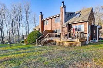a house with a large deck on a yard at Near Hiking and Skiing Hunter Mountain Getaway! in Elka Park