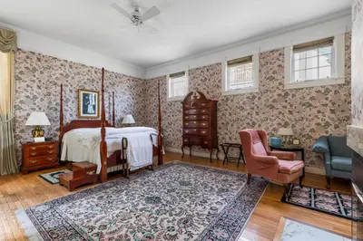 a bedroom with a bed and a chair at South Shire in Bennington