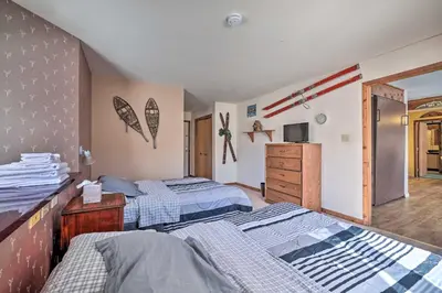 a bedroom with two twin beds and a dresser at Next to Shawnee Mtn Ski Area Inviting Condo! in East Stroudsburg