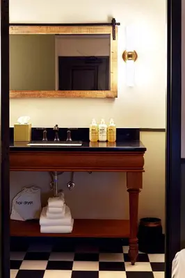 a bathroom with a sink and a mirror at Berkshires Untold in Lenox
