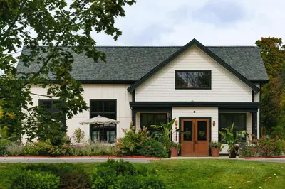 a white house with a black roof at Berkshires Untold in Lenox