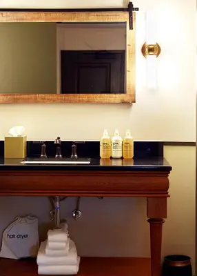 a bathroom counter with a sink and a mirror at Berkshires Untold in Lenox