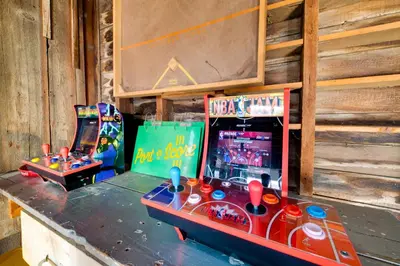 two arcade games sitting on top of a counter at Less Than 4 Mi to Cooperstown Charming Historic Home! in Fly Creek