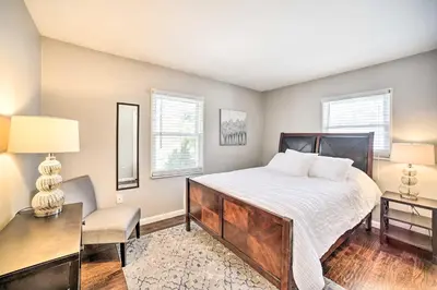 a bedroom with a bed and a desk and a chair at Updated Home in the Heart of Saratoga Springs in Saratoga Springs