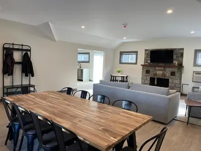 a living room with a table and a couch at East Rock Inn in Great Barrington