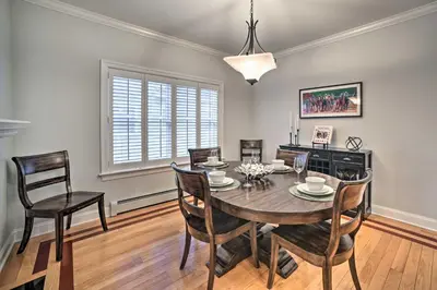 a dining room with a table and chairs at Stunning House with Deck, Game Room and Home Gym! in Saratoga Springs