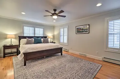 a bedroom with a bed and a ceiling fan at Stunning House with Deck, Game Room and Home Gym! in Saratoga Springs