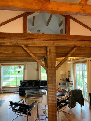 a living room with a couch and a table at Harpersfield House /North West Catskills + sauna in Jefferson