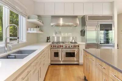 a kitchen with a stove and a sink at Sunny Day on Taunton Lake in Newtown
