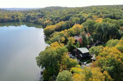an aerial view of a house next to a lake at Sunny Day on Taunton Lake in Newtown