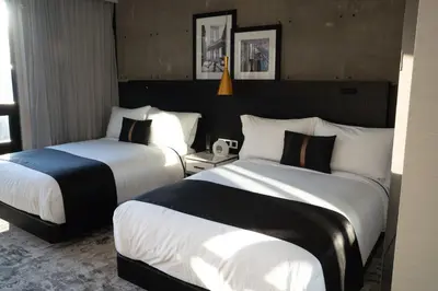 a hotel room with two beds in a room at 42 Hotel Williamsburg in Brooklyn