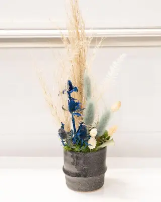 a black vase with some plants in it at 42 Hotel Williamsburg in Brooklyn