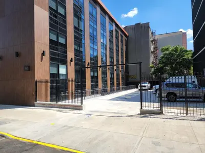 a building with a gate in front of a building at 42 Hotel Williamsburg in Brooklyn