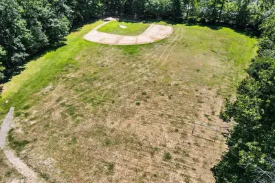an aerial view of a field with a park at Highland Hideaway in East Stroudsburg
