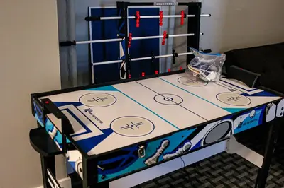 a table with a hockeyhibition at A Luxurious 5 star Location 2 QUEEN Bed’s TROY in Troy