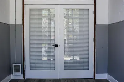 a white door with a window with blinds on it at A Luxurious 5 star Location 2 QUEEN Bed’s TROY in Troy