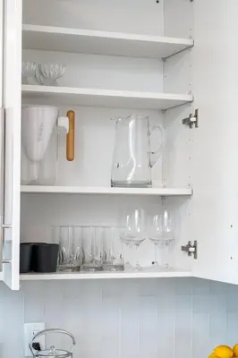 a kitchen shelf with glasses and a blender on it at Hyatus Luxury Residences City Crossing in New Haven