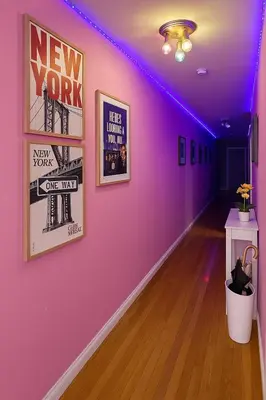 a room with a purple wall with pictures on it at Lemon Vibes room in Guesthouse in New York