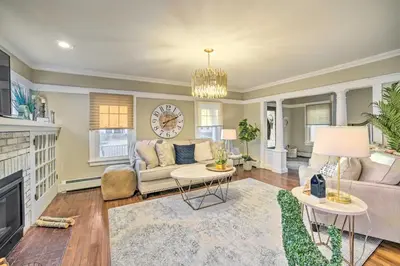 a living room with a couch and a fireplace at Family-Friendly Glens Falls Home with Sun Porch in Glens Falls