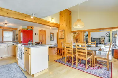 a kitchen and dining room with a table and chairs at Storybook Stratton House 3 Mi to Mount Snow! in Stratton