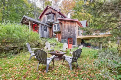 a group of chairs sitting in front of a house at Storybook Stratton House 3 Mi to Mount Snow! in Stratton