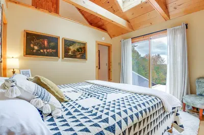 a bedroom with a bed and a window at Storybook Stratton House 3 Mi to Mount Snow! in Stratton
