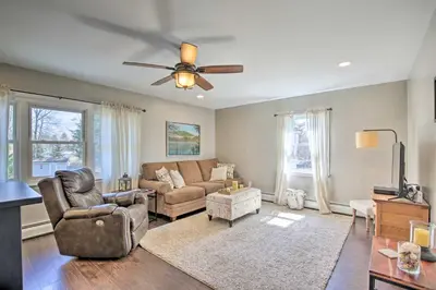 a living room with a couch and a ceiling fan at Stylish Pine Plains Home Near Parks and Hiking! in Pine Plains