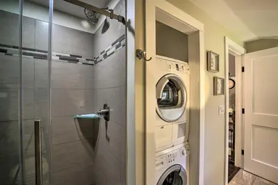 a washer and dryer in a bathroom next to a shower at Stylish Pine Plains Home Near Parks and Hiking! in Pine Plains
