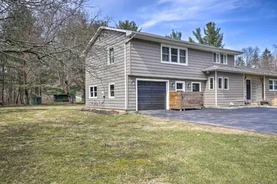 a house with a garage and a driveway at Stylish Pine Plains Home Near Parks and Hiking! in Pine Plains