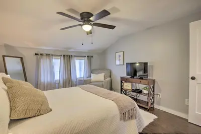 a bedroom with a bed and a ceiling fan at Stylish Pine Plains Home Near Parks and Hiking! in Pine Plains
