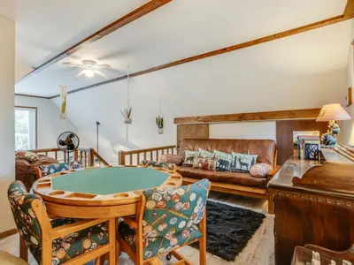 a living room with a ping pong table and a couch at Elmwood Elmwood Escape A Cozy Retreat at The Hideout in Hamlin