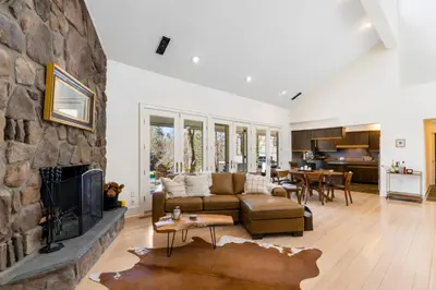 a living room with a couch and a fireplace at Catskill Getaway on 6 Acres with Swimming Pond! in Liberty